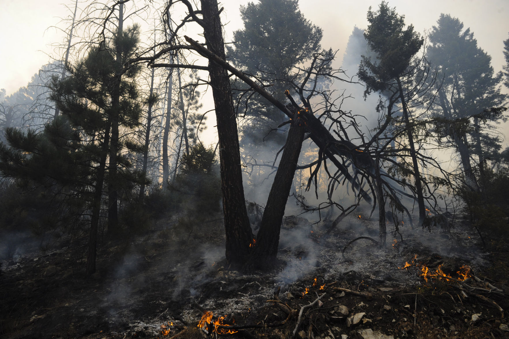 Roughly one hundred personnel and multiple aircraft help battle a lightening caused fire south of Helena Thursday afternoon.